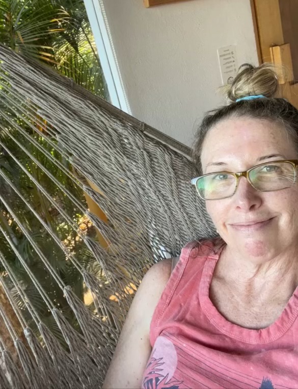 Karin relaxing in a hammock on vacation in Mexico
